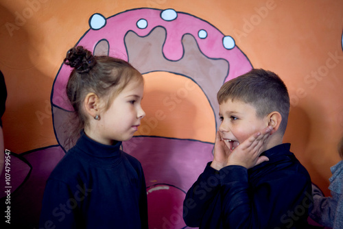 5-7 year old children at an acting class with their teacher, extracurricular activities photo