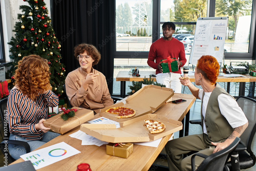 A group of cheerful coworkers enjoy a festive Christmas celebration in their office with gifts. A group of cheerful coworkers enjoy a festive Christmas celebration in their office with gifts.