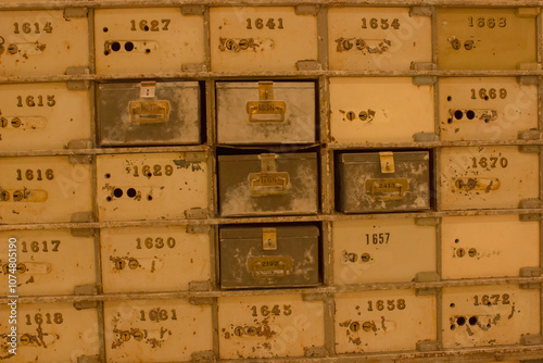 Old safe deposit boxes in the old vault of the Central Bank of Barcelona. Detail of the double keys to the safe deposit boxes in the old vault.