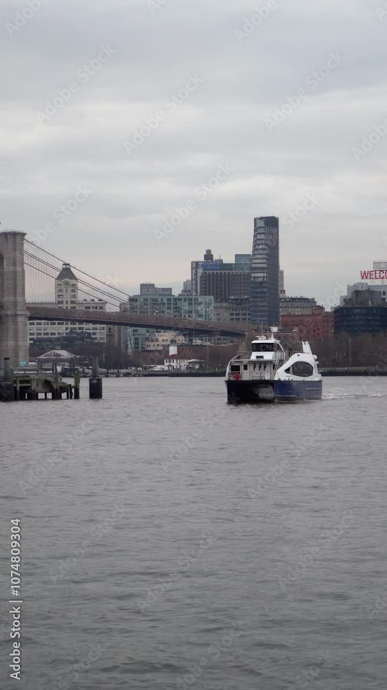 Ferry approaches Manhattan with the stunning Brooklyn Bridge Ferry approaches Manhattan with the stunning Brooklyn Bridge