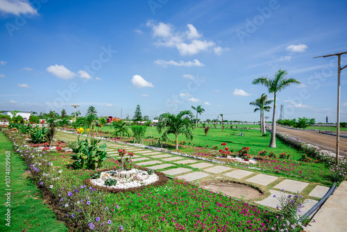 Beautiful garden with green plants and flowers 