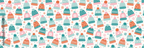 Seamless texture with colourful hand drawn winter hats. Christmas background design. Banner. Vector illustration