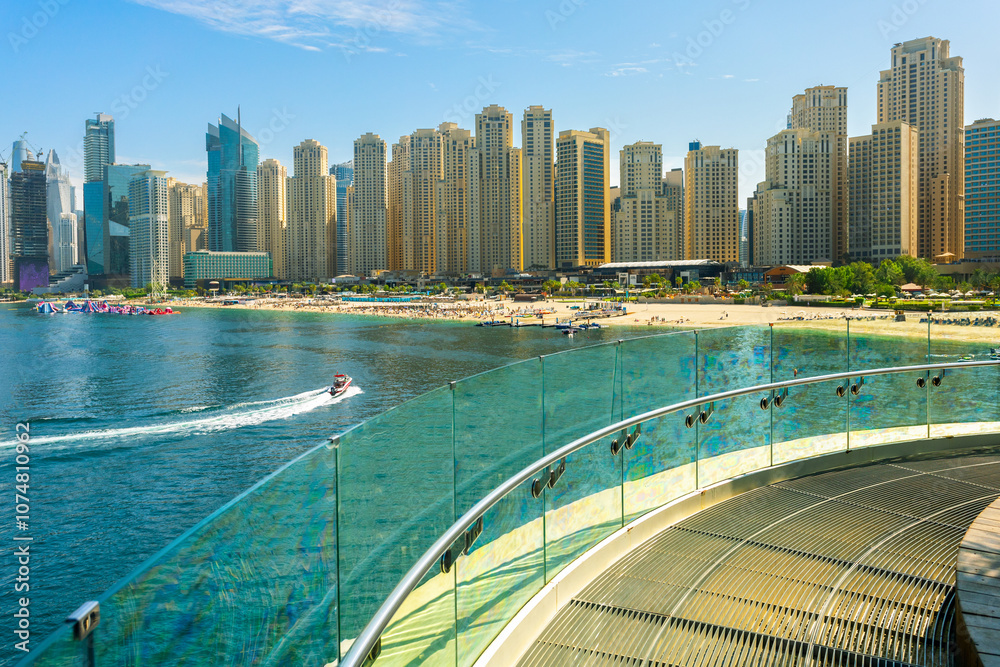 Naklejka premium Beautiful view of JBR beach in Dubai. Dubai jumeirah beach with hotels, sea, sand, palms and blue sky.