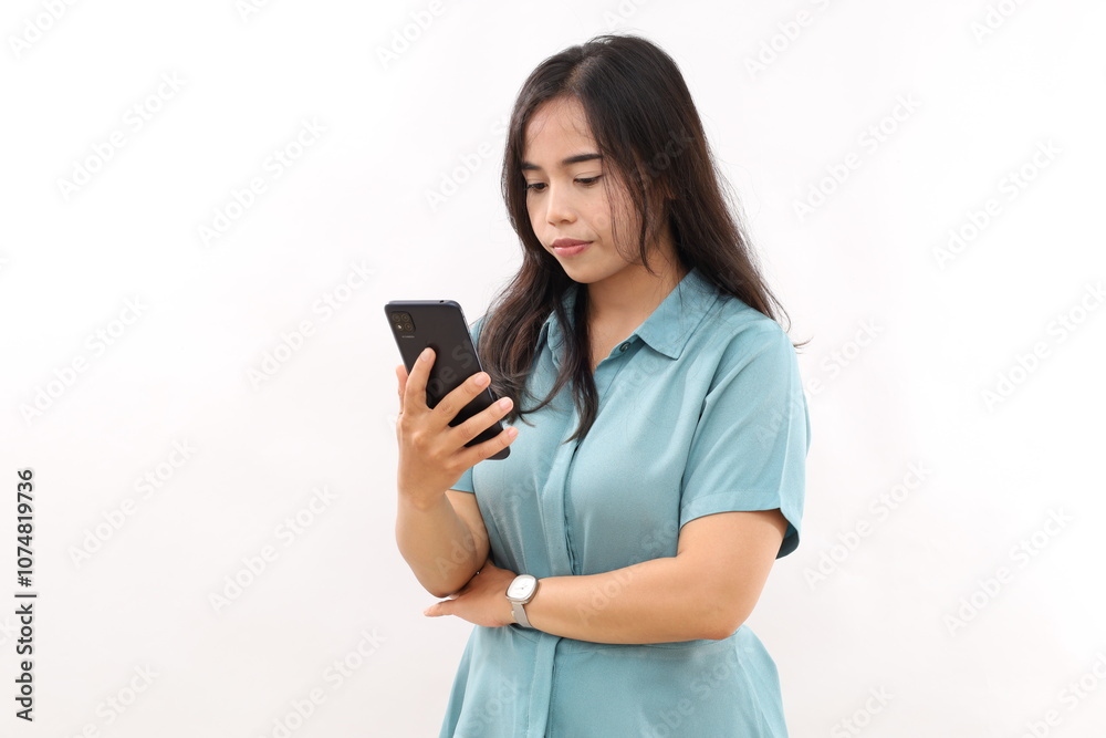 Asian businesswoman using mobile phone isolated over white background. Girl holding the smartphone in casual shirt . Copy space Asian businesswoman using mobile phone isolated over white background. Girl holding the smartphone in casual shirt . Copy space