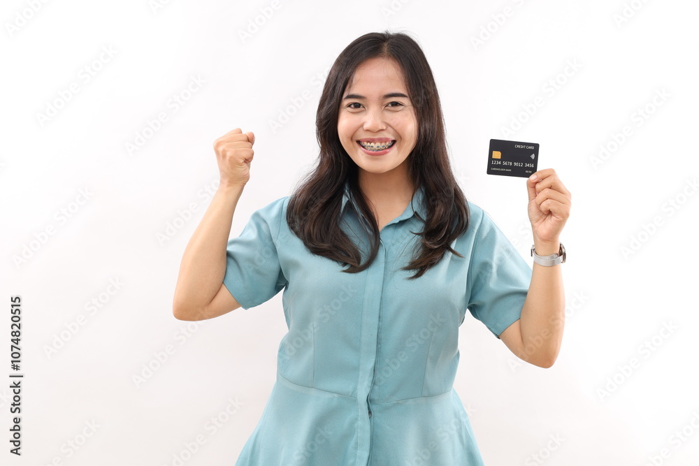 Excited young woman winning prize, see awesome promo sale, showing credit card and scream of joy, saying yes, standing against white background Excited young woman winning prize, see awesome promo sale, showing credit card and scream of joy, saying yes, standing against white background
