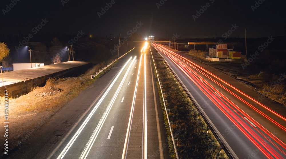 Highway car light trails at night. Highway car light trails at night.