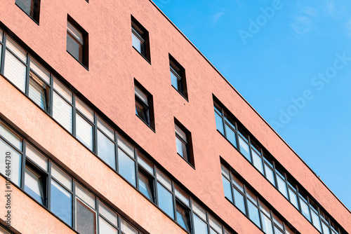 Eastern Europe poor modern architecture design building exterior perspective facade wall concrete front side with windows and blue sky background