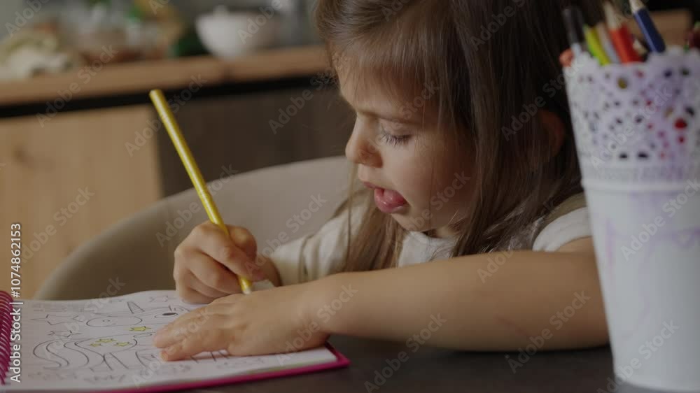 A Child Engaged in a Creative and Colorful Coloring Activity at Home with Various Materials