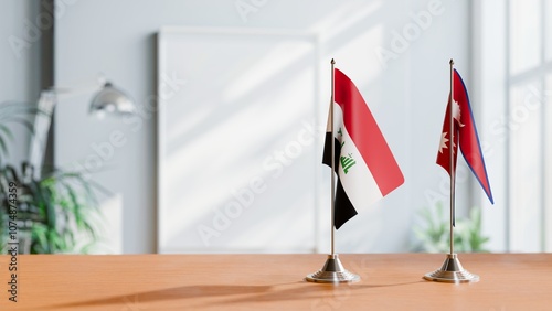 FLAGS OF IRAQ AND NEPAL ON TABLE photo