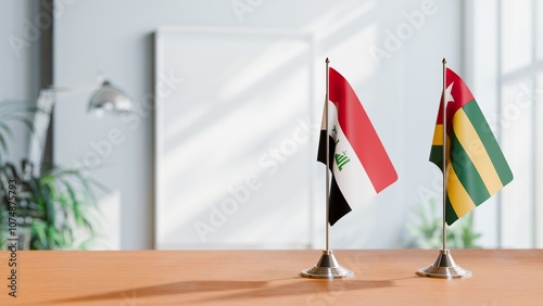 FLAGS OF IRAQ AND TOGO ON TABLE photo