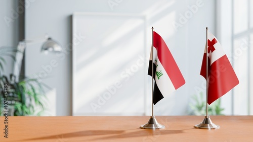 FLAGS OF IRAQ AND TONGA ON TABLE photo