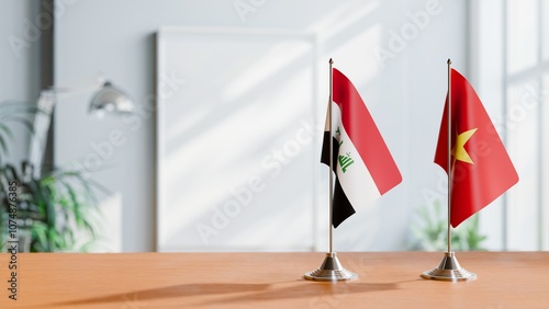 FLAGS OF IRAQ AND VIETNAM ON TABLE photo