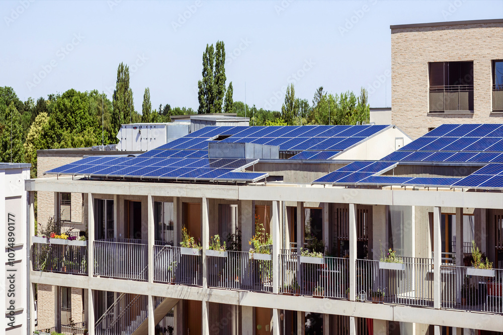 View of Modern Apartment Building with Solar Panels Roof and Urban Terrace and ...