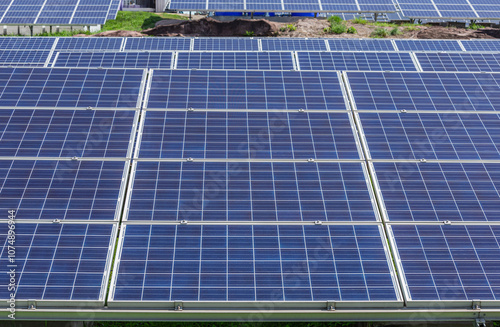 rows array of solar cells or photovoltaics in solar power station convert light energy from the sun into electricity alternative renewable clean energy efficiency from the sun