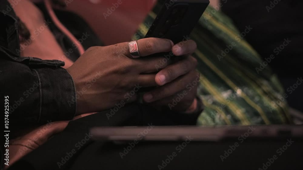Man typing on his phone Man typing on his phone
