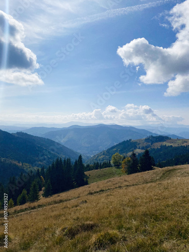 Scenic mountain landscape with blue sky and white clouds. Carpathian mountains, Ukraine.