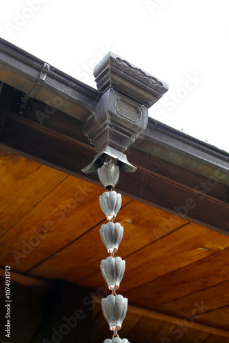 Japanese house rain gutter. Rain chains photo