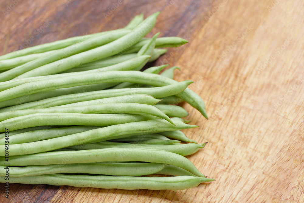 Fresh needle beans on cutting board Fresh needle beans on cutting board