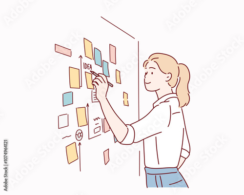  male employee write on colorful sticky notes develop business project in office, concentrated biracial man worker brainstorm engaged in creative thinking make startup plan.
