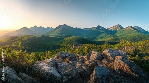 A breathtaking panorama of the Presidential Range at sunset, showcasing the lush green mountains and rocky terrain photo