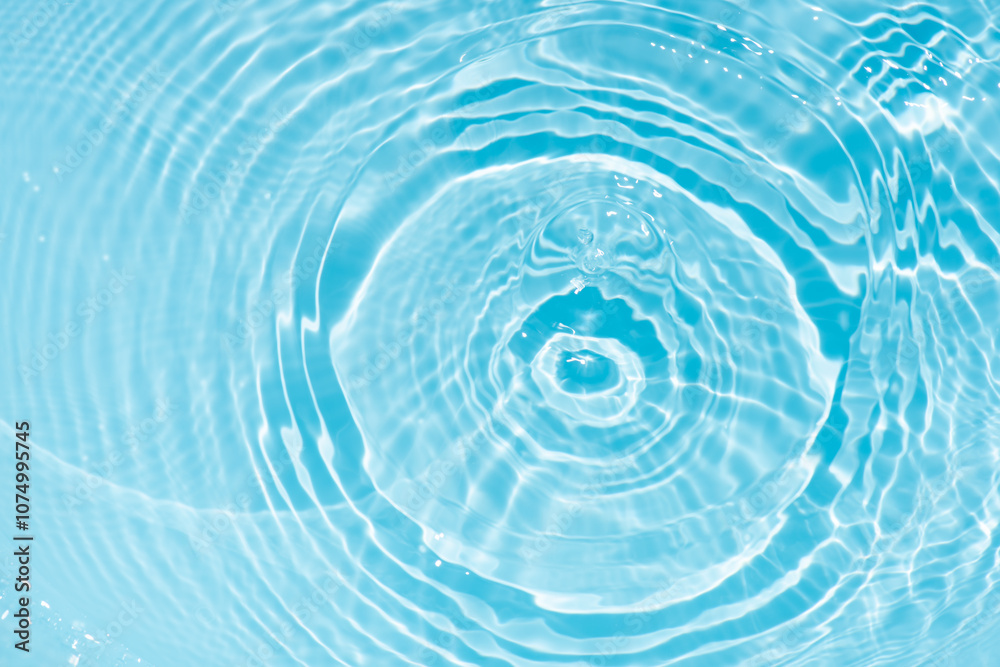 Blue water with ripples on the surface. Defocus blurred transparent blue colored clear calm water surface texture with splashes and bubbles. Water waves with shining pattern texture background. Blue water with ripples on the surface. Defocus blurred transparent blue colored clear calm water surface texture with splashes and bubbles. Water waves with shining pattern texture background.