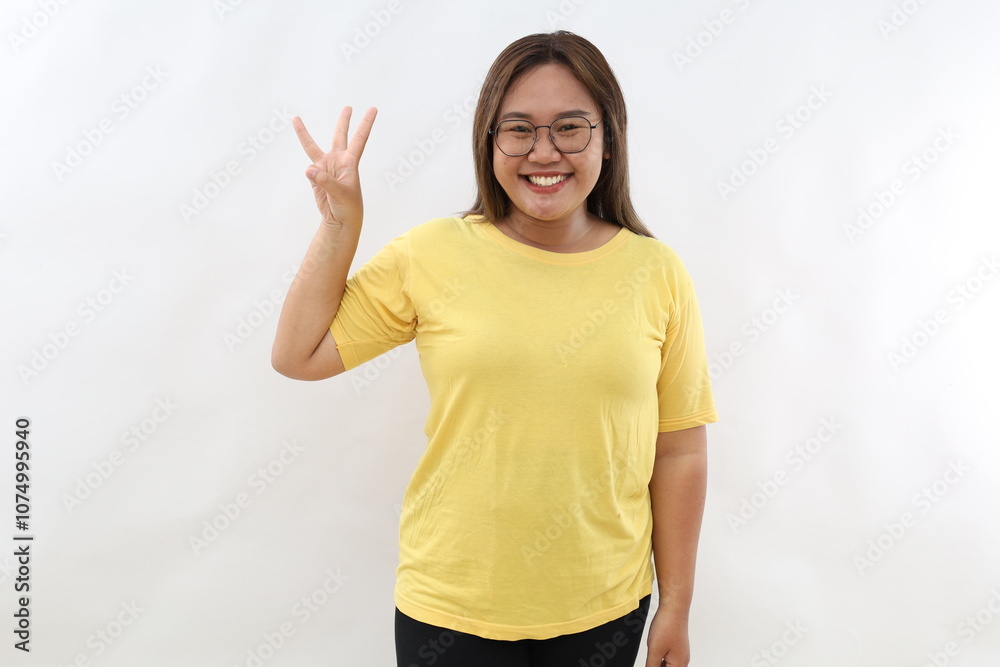 Smiling happy good-looking asian girl giving advice, showing three fingers as explain rules, make point, standing white background Smiling happy good-looking asian girl giving advice, showing three fingers as explain rules, make point, standing white background