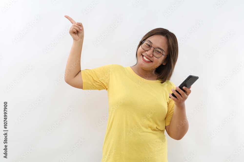 Portrait of beautiful asian woman using smartphone on white background.Pointing up copy space Portrait of beautiful asian woman using smartphone on white background.Pointing up copy space