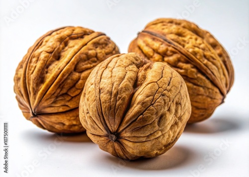 Three walnuts, candid group portrait, isolated on white.