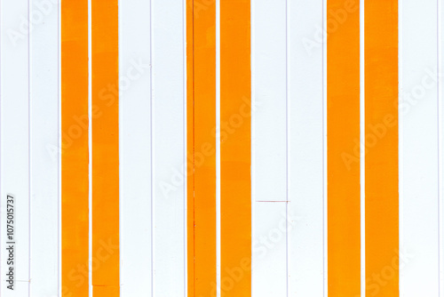 white and yellow orange stripes wall of beach house, close up, painted wooden background