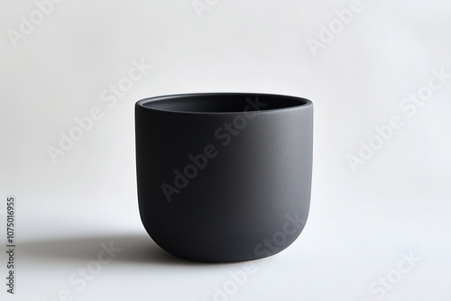 Minimalistic black cup on white background