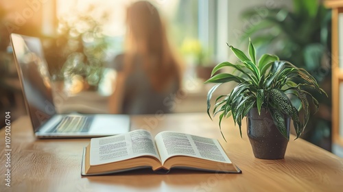 A motivational book beside her keyboard, unread photo