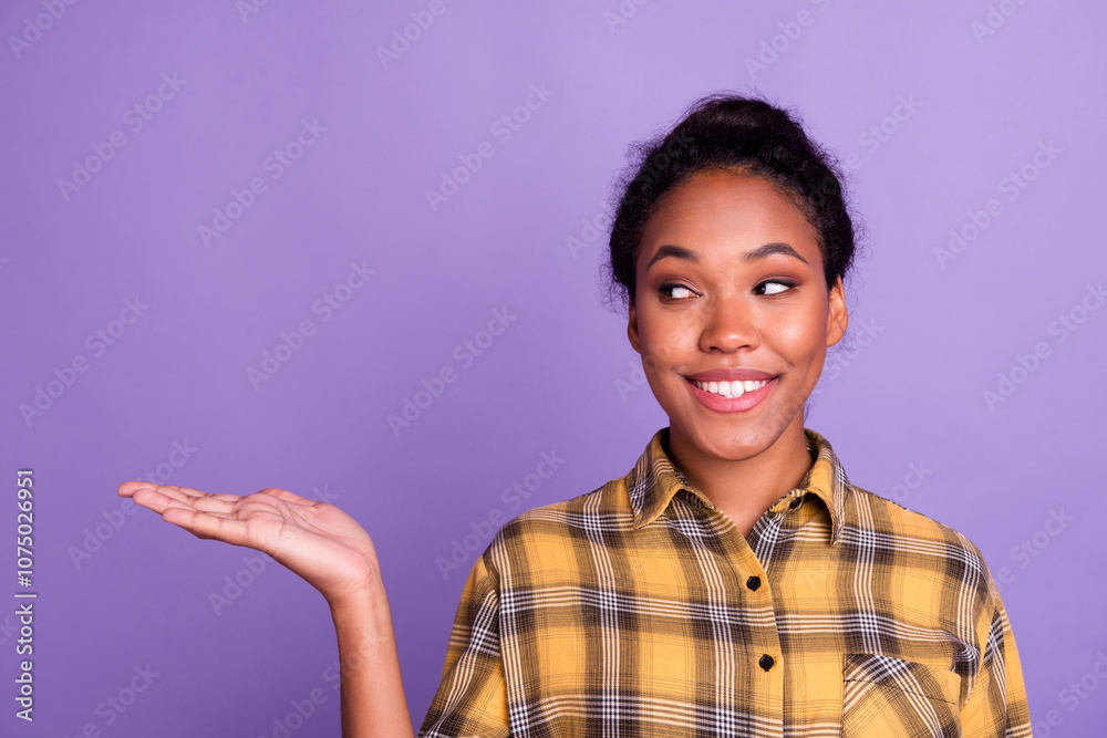 Excited young woman outstretching cupped hand, trying to hold something invisible on her palm, giving it away or asking for something, purple wall Excited young woman outstretching cupped hand, trying to hold something invisible on her palm, giving it away or asking for something, purple wall