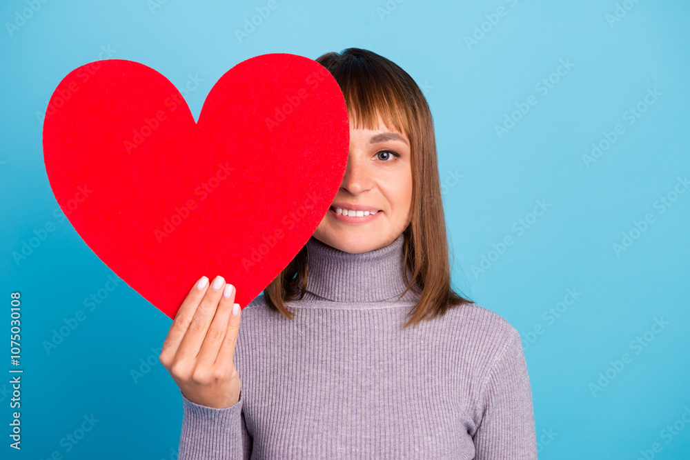 Photo of pretty cute lady hold big paper red heart creative postcard inviting boyfriend romance date wear knitted blue sweater white trousers isolated blue color background Photo of pretty cute lady hold big paper red heart creative postcard inviting boyfriend romance date wear knitted blue sweater white trousers isolated blue color background