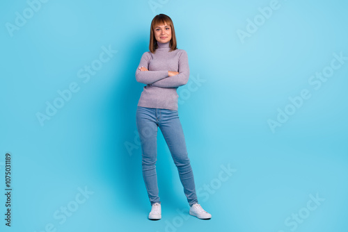 Young brunette confident woman 20s in stylish casual hold hands crossed folded isolated on color background studio portrait. People lifestyle concept