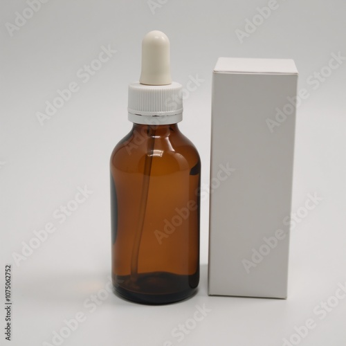 Clear amber glass lab bottle with white lid suitable for chemical storage photo
