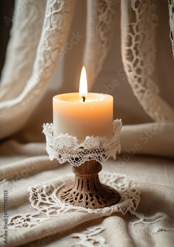 Warm candlelight in a handmade lace candlestick, placed on a linen cloth with soft daylight shadows