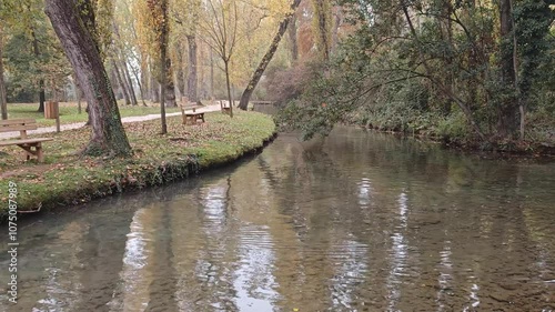 Wallpaper Mural Pathway near the idyllic lake of Fonti del Clitunno in autumn season, Umbria region, Italy Torontodigital.ca