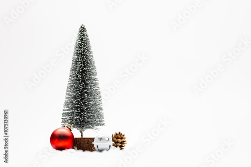 Christmas tree with bulb, pinecone and jingle bells on white background. Christmas decoration for banner