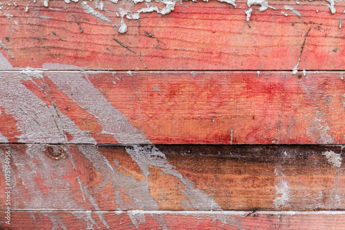 Grungy red wooden wall with concrete spots, background texture photo