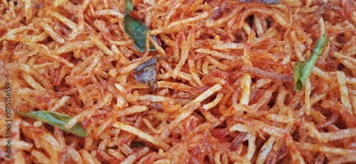 Kentang kering mustofa balado or dried crispy spicy potatoes is delicious traditional food from Indonesia photo