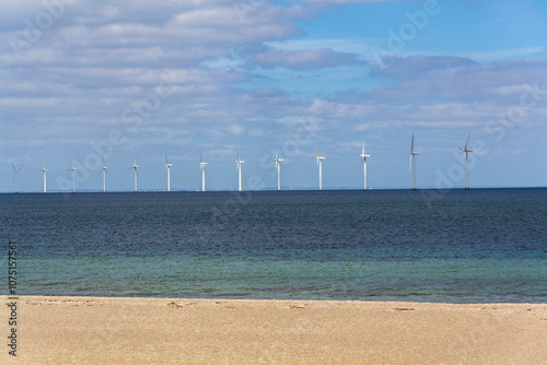 White turbines of Middelgrunden wind farm outside Copenhagen, Denmark, sustainable renewable electricity concept photo