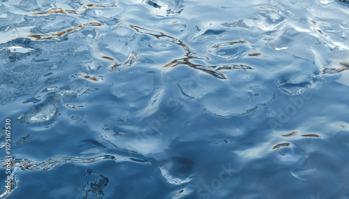 Illustration of Sunlight reflecting off the gentle ripples of a serene blue water surface. photo