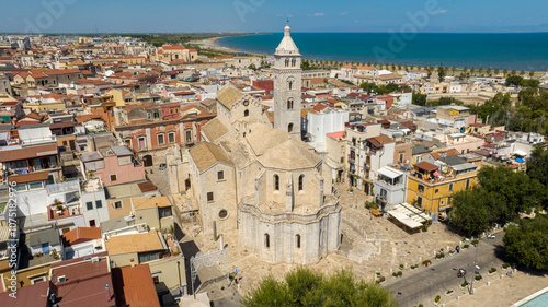 Fototapeta Naklejka Na Ścianę i Meble -  Aerial view of the Basilica of Santa Maria Maggiore in the historic center of Barletta, Puglia, Italy. It is the cathedral and it was built in Romanesque style. In background is the Adriatic sea.