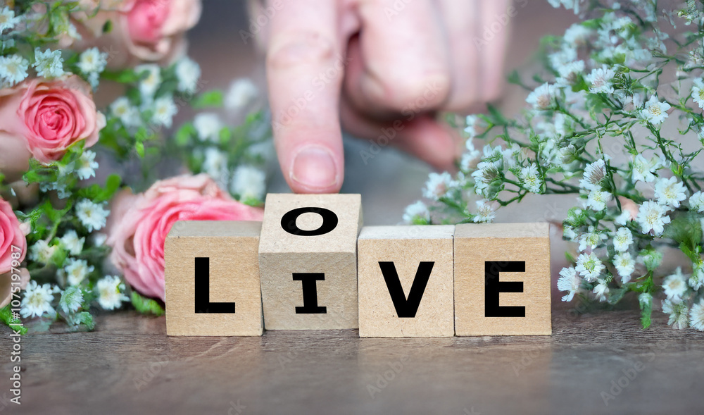 Cubes form the words live and love. Cubes form the words live and love.