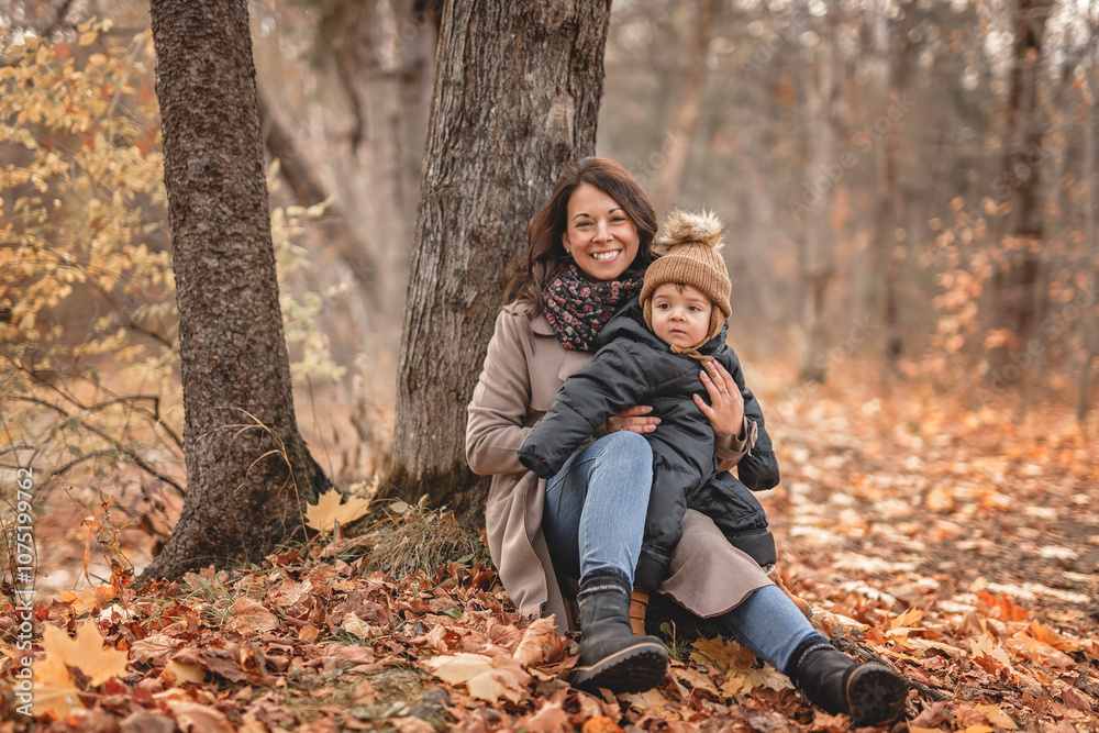 Joyful mother and his little baby. mother and child have fun, laugh and enjoy nature outdoors at autumn park. Joyful mother and his little baby. mother and child have fun, laugh and enjoy nature outdoors at autumn park.