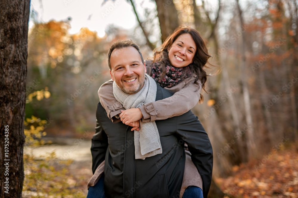 Couple Embracing on Park Bench. lovely couple kissing outdoors in autumn Couple Embracing on Park Bench. lovely couple kissing outdoors in autumn