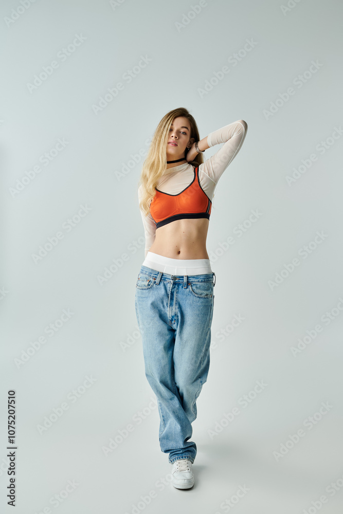 A stylish young woman showcases her fashion sense with a confident pose in a clean studio. A stylish young woman showcases her fashion sense with a confident pose in a clean studio.