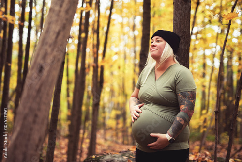 Nice Leabian pregnant woman in autumn park photo