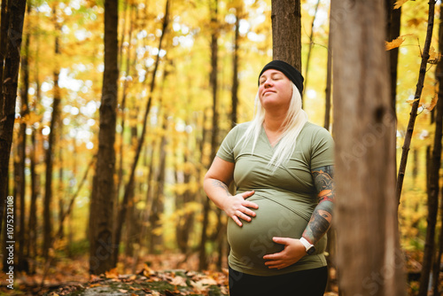 Nice Leabian pregnant woman in autumn park photo