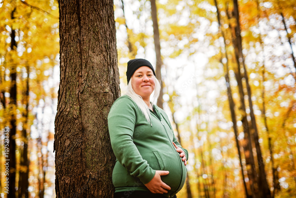 Nice Leabian pregnant woman in autumn park Nice Leabian pregnant woman in autumn park